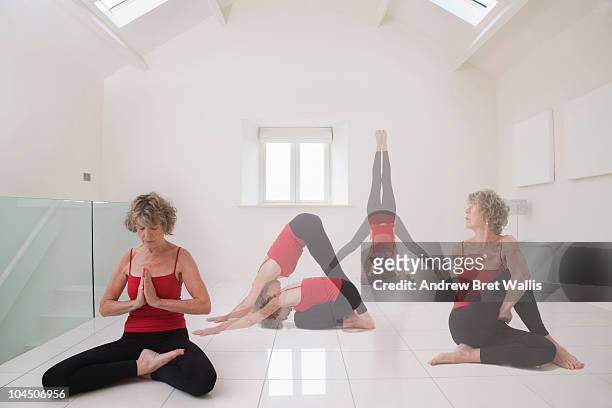 senior woman doing a series of yoga excercises - mehrfachbelichtung bewegung stock-fotos und bilder