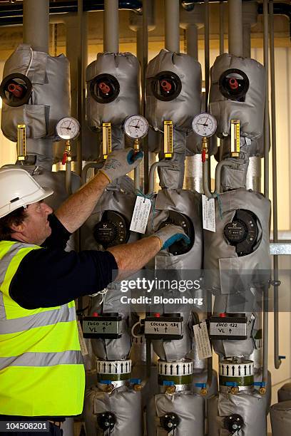 Keith Barnes a technical operator checks controls in the primary digestion control room at Severn Trent's crop fed power plant in Stoke Bardolph,...