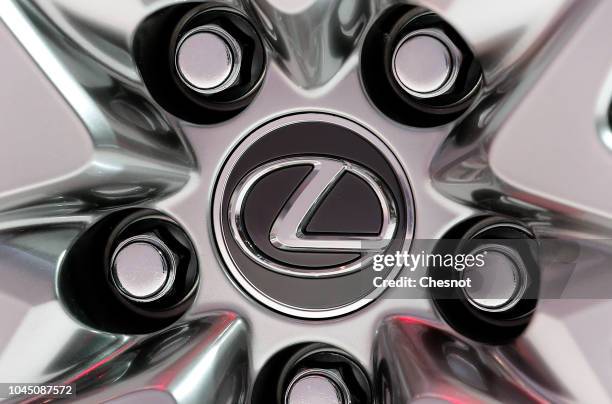 The logo of the Japonese car manufacturer Lexus is on display on a rim during the second press day of the Paris Motor Show at the Parc des...