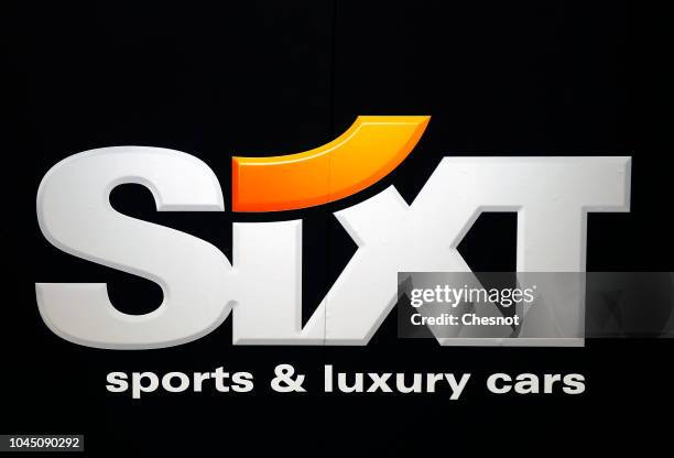 The logo of the German car rental company Sixt is on display during the second press day of the Paris Motor Show at the Parc des Expositions at the...