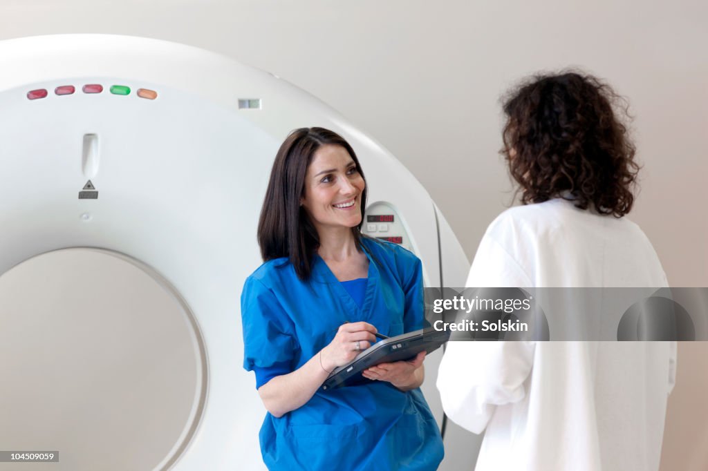 Healthcare person and patient by ct-scanner