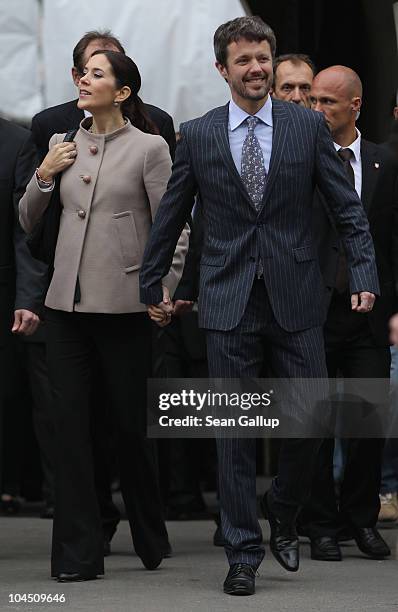 Danish Crown Prince Frederik and Danish Crown Princess Mary, who is pregnant with twins, walk in the city center on September 28, 2010 in Guestrow,...