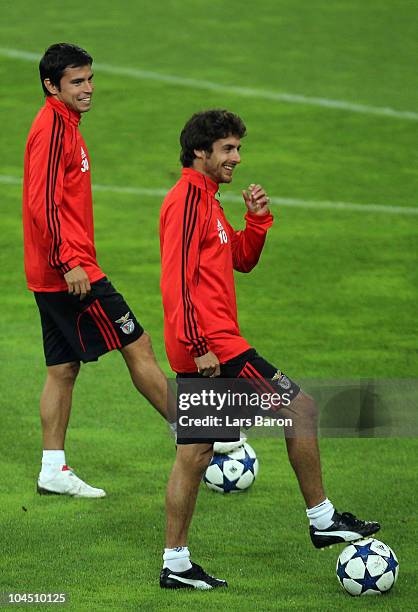 Pablo Aimar and Javier Saviola smile during a SL Benfica training session ahead of the UEFA Champions League match against FC Schalke 04 at Veltins...