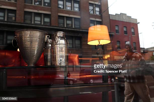 Silver martini shaker and ice bucket are viewed in the window of a store on September 28, 2010 in the Brooklyn borough of New York City. A new report...