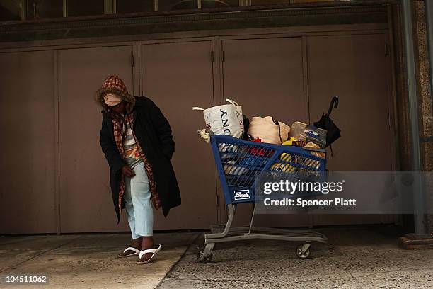 Homeless woman stands in the street on September 28, 2010 in the Brooklyn borough of New York City. A new report released by the U.S. Census Data...