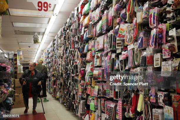 People shop in a dollar store on September 28, 2010 in the Brooklyn borough of New York City. A new report released by the U.S. Census Data shows...