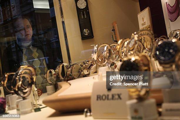 Man looks at Rolex watches on display in a window on September 28, 2010 in New York City. A new report released by the U.S. Census Data shows that...