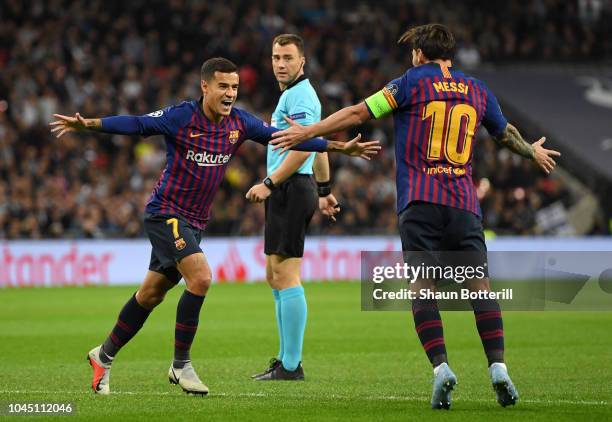 Philippe Coutinho of Barcelona celebrates with team mate Lionel Messi of Barcelona after scoring his team's first goal during the Group B match of...