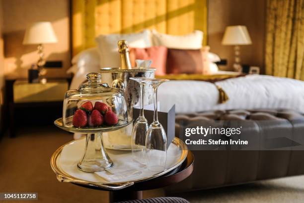 Plate of strawberries and a bottle of champagne await the guests inside a luxury hotel room in Hong Kong.