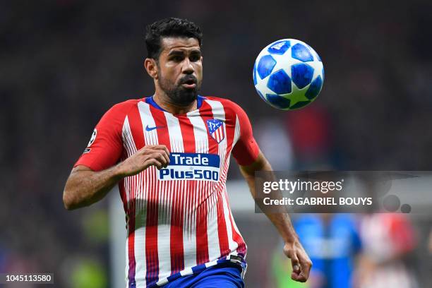 Atletico Madrid's Spanish forward Diego Costa eyes the ball during the UEFA Champions League group A football match between Club Atletico de Madrid...