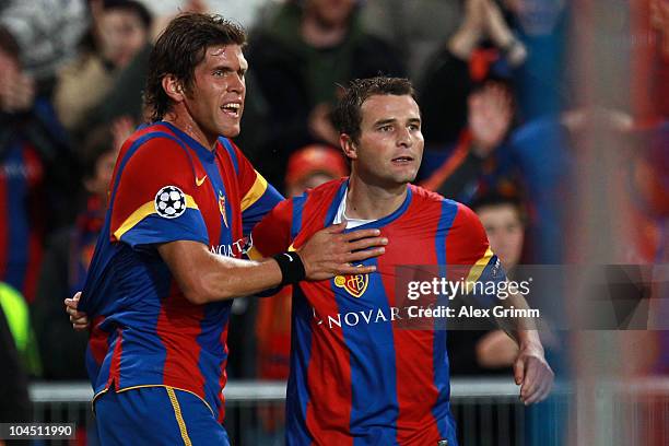 Alexander Frei of Basel celebrates his team's first goal with team mate Benjamin Huggel during the UEFA Champions League group E match between FC...