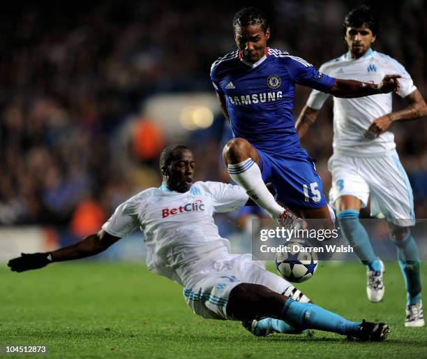 Souleymane Diawara of Marseille tackles Florent Malouda of Chelsea during the UEFA Champions League Group F match between Chelsea FC and Marseille at...