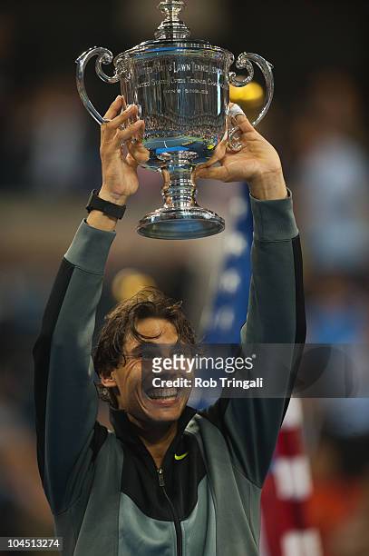 Rafael Nadal raises the US Open Trophy after defeating Novak Djokovic in the men's final on day fifteen of the 2010 U.S. Open at the USTA Billie Jean...