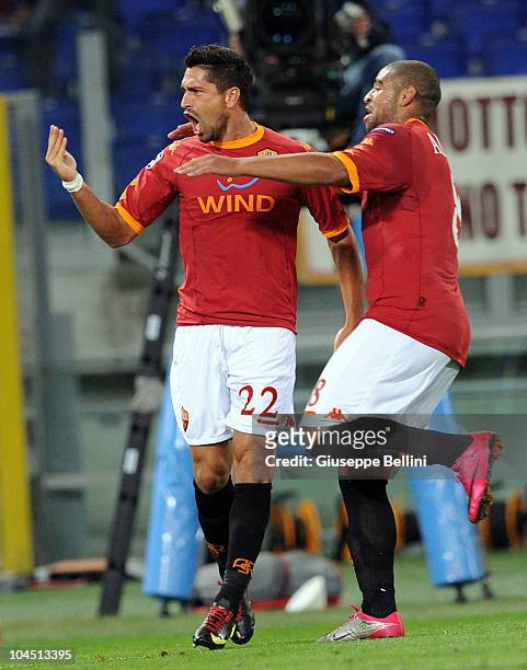 Marco Borriello of Roma celebrates his 2-0 goal with team-mate Adriano during the UEFA Champions League group E match between AS Roma and CFR Cluj at...