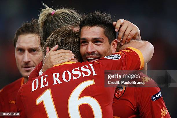 Marco Borriello of AS Roma celebrates with Daniele De Rossi after scoring their team's 2-0 goal during the UEFA Champions League group E match...