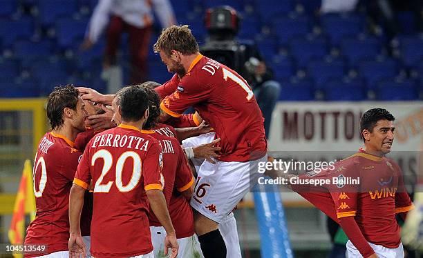 Daniele De Rossi and AS Roma team-mates celebrate Marco Borriello's 2-0 goal during the UEFA Champions League group E match between AS Roma and CFR...
