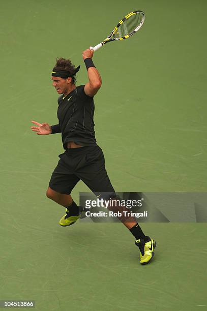 Rafael Nadal hits a return to Novak Djokovic in the men's final on day fifteen of the 2010 U.S. Open at the USTA Billie Jean King National Tennis...