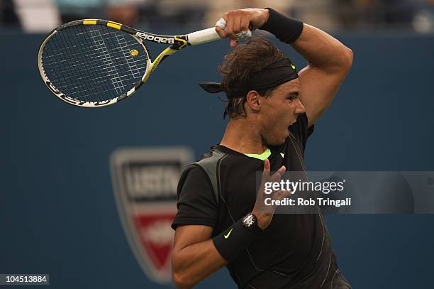 Rafael Nadal hits a return to Novak Djokovic in the men's final on day fifteen of the 2010 U.S. Open at the USTA Billie Jean King National Tennis...