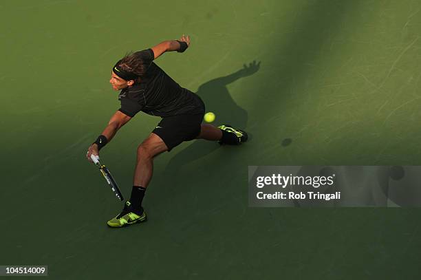 Rafael Nadal hits a return to Novak Djokovic in the men's final on day fifteen of the 2010 U.S. Open at the USTA Billie Jean King National Tennis...