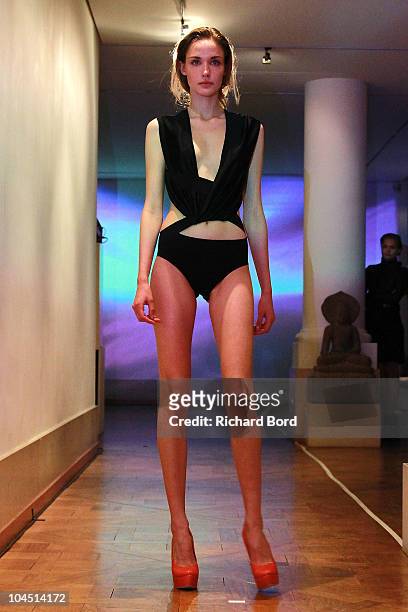 Model walks the runway during the Anthony Vaccarello Ready to Wear Spring/Summer 2011 show during Paris Fashion Week at Galerie Joyce on September...