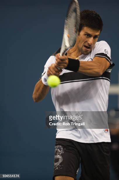 Novak Djokovic hits a return to Rafael Nadal in the men's final on day fifteen of the 2010 U.S. Open at the USTA Billie Jean King National Tennis...