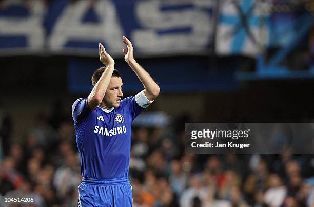 John Terry, captain of Chelsea salutes the home support during the UEFA Champions League Group F match between Chelsea and Marseille at Stamford...
