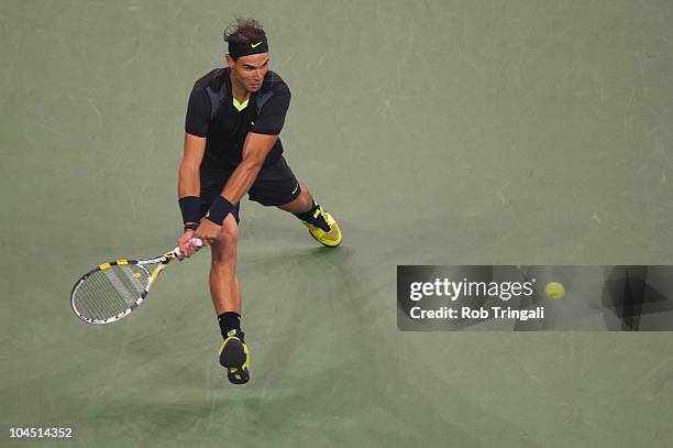 Rafael Nadal hits a return to Novak Djokovic in the men's final on day fifteen of the 2010 U.S. Open at the USTA Billie Jean King National Tennis...