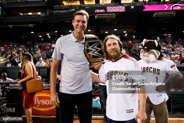 Superstar Daniel Bryan meets Arizona Diamondbacks alumni Randy Johnson prior to a game against the Los Angeles Dodgers at Chase Field on September...