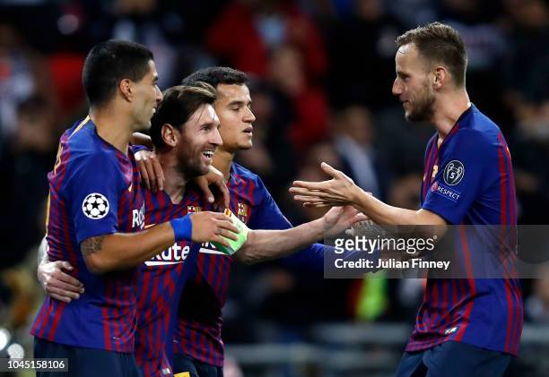 Lionel Messi of Barcelona celebrates after scoring his team's third goal with teammates Luis Suarez, Philippe Coutinho and Ivan Rakitic during the...