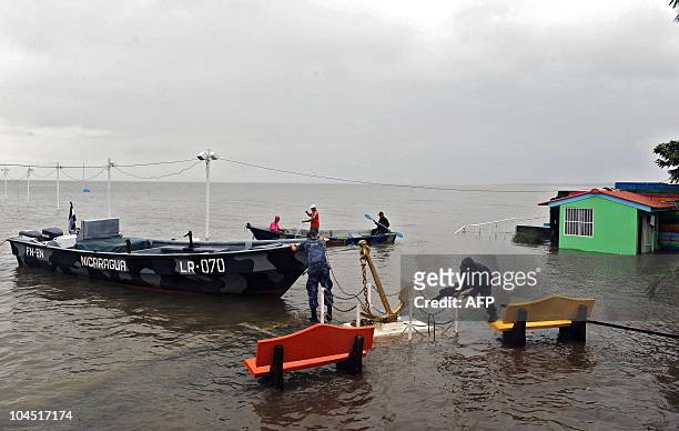 Nicaraguan officials inspect a flooded area in the banks of Xolotlan lake in Managua, on September 28, 2010. The Nicaraguan government declared a...