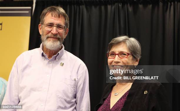 University of Missouri professor George P. Smith stands on stage with his wife Marjorie, following a press conference announcing he has won the 2018...