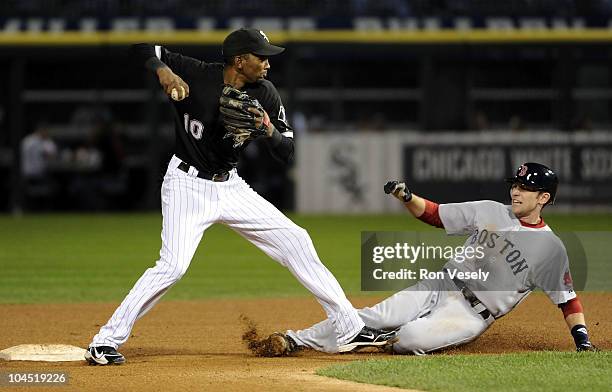 Alexei Ramirez of the Chicago White Sox makes a forced out at second base as Jed Lowrie of the Boston Red Sox slides late on September 28, 2010 at...