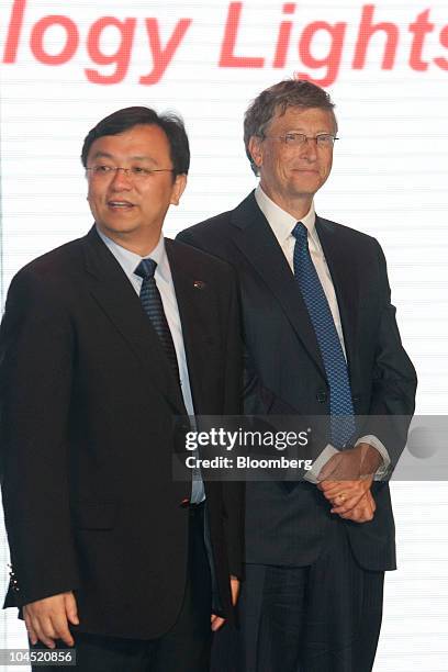 Wang Chuanfu, chairman of BYD Co., left, and Bill Gates, founder of Microsoft Inc., attend the launch of the BYD Co. M6 automobile in Beijing, China,...