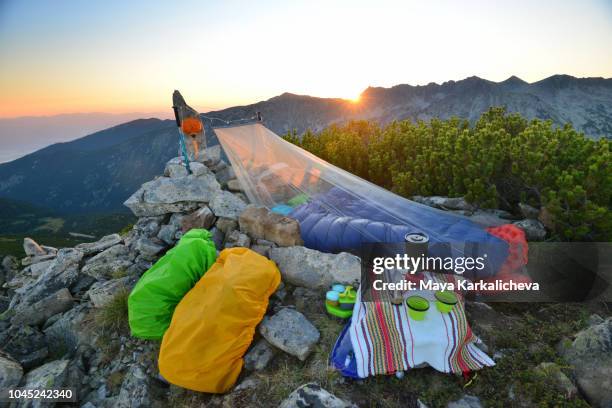 sleeping under the stars, bivouac at mountain peak at sunrise - netting stock pictures, royalty-free photos & images
