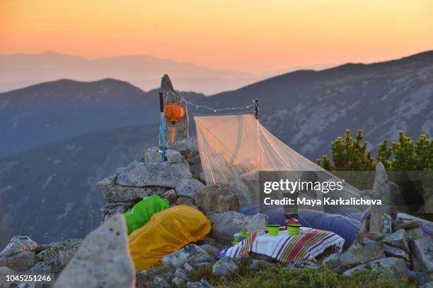 bivouac at mountain peak at sunrise - pirin mountains stockfoto's en -beelden