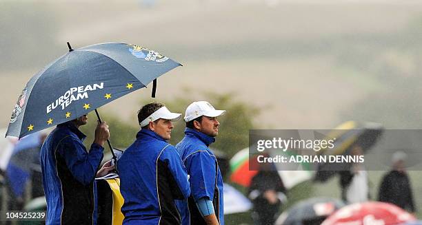 Europe Ryder Cup players Luke Donald and Graeme McDowell wait to play during a practice session at Celtic Manor golf course in Newport, Wales on...