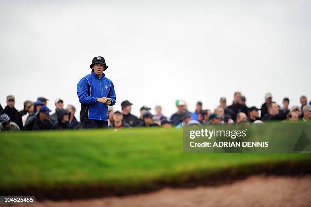 Europe Ryder Cup player Lee Westwood stands on a green during a practice session at Celtic Manor golf course in Newport, Wales on September 29, 2010....