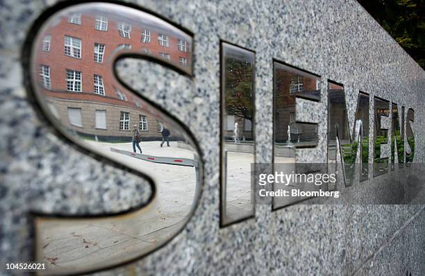 The Siemens AG company logo sits on display at the factory in Berlin, Germany, on Tuesday, Sept. 28, 2010. Siemens AG, Europe's largest engineering...