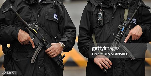 Armed British police officers pose for a photograph in central London on September 29, 2010. Washington's top intelligence official on Wednesday...