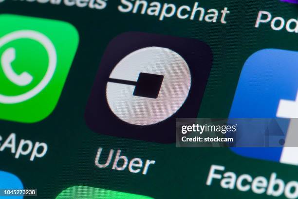 uber, whatsapp, facebook and other apps on iphone screen - taxi logo stock pictures, royalty-free photos & images
