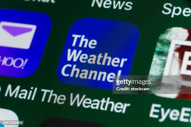 the weather channel, yahoo mail, eyeem and other apps on iphone screen - eyeem stock pictures, royalty-free photos & images