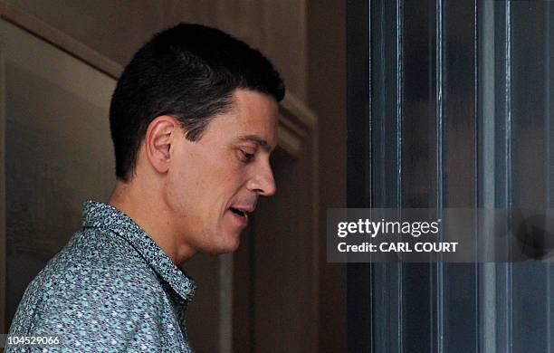 Britain's opposition Labour Party's former Foreign Secretary, and defeated candidate for the party's Leadership, David Miliband, re-enters his house...