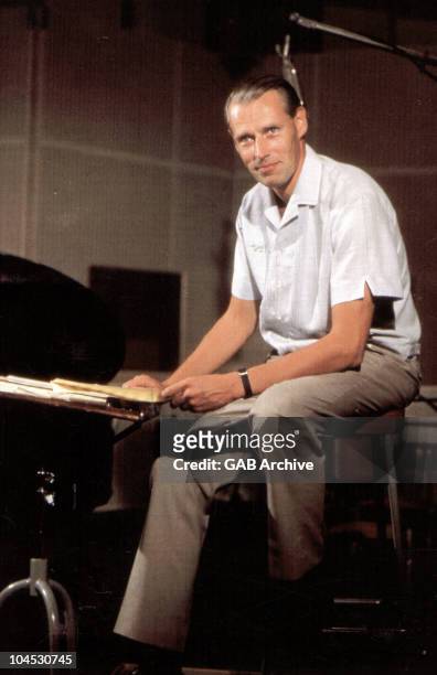 Photo of English record producer and arranger George Martin