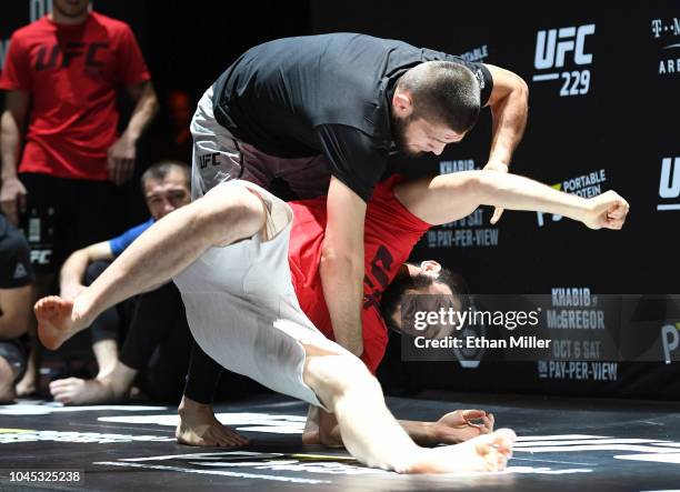 Lightweight champion Khabib Nurmagomedov throws a sparring partner during an open workout for UFC 229 at Park Theater at Park MGM on October 03, 2018...