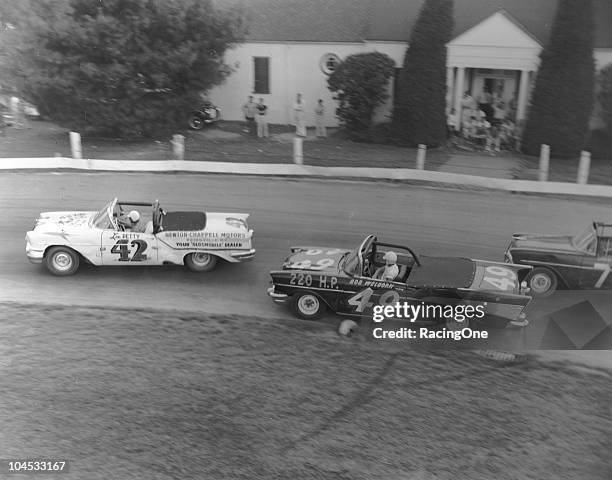 Lee Petty in an Oldsmobile leads Bob WelbornÕs Chevrolet and Larry FrankÕs Õ56 Chevrolet during a NASCAR Convertible Series race at Bowman-Gray...