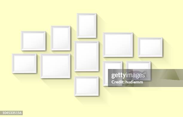 vector blank vintage picture frames on wall background - modern art exhibition stock illustrations