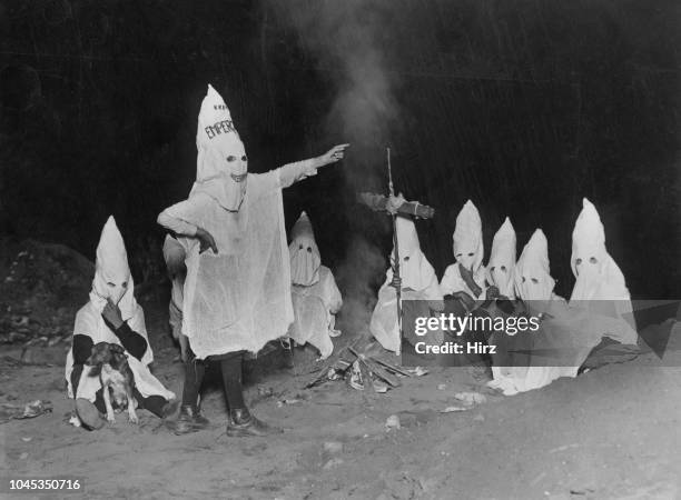 Group of children mimicking the regalia and activities of the Ku Klux Klan, East Lots, Canarsie, Brooklyn, New York City, circa 1925. Calling...