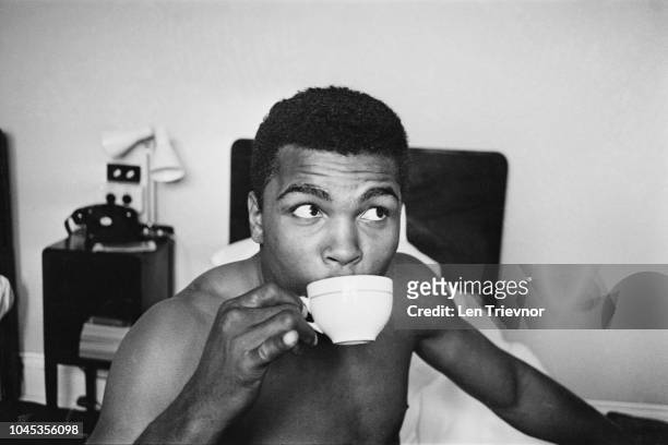 American Heavyweight boxer, Cassius Clay , relaxing his hotel room, London, 27th May 1963. Clay is in London for a match against Henry Cooper on 18th...