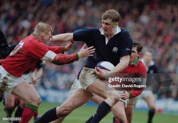 Doddie Weir of Scotland, hands off Neil Jenkins of Wales during a Five Nations Championship match at Murrayfield Stadium, Edinburgh, Scotland, 4th...