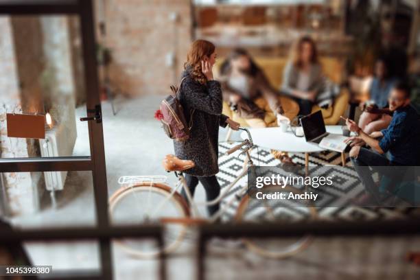 friends riding bicycle on the campus and having fun - tilt shift stock pictures, royalty-free photos & images